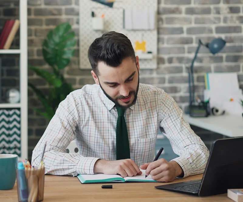 Man writing notes