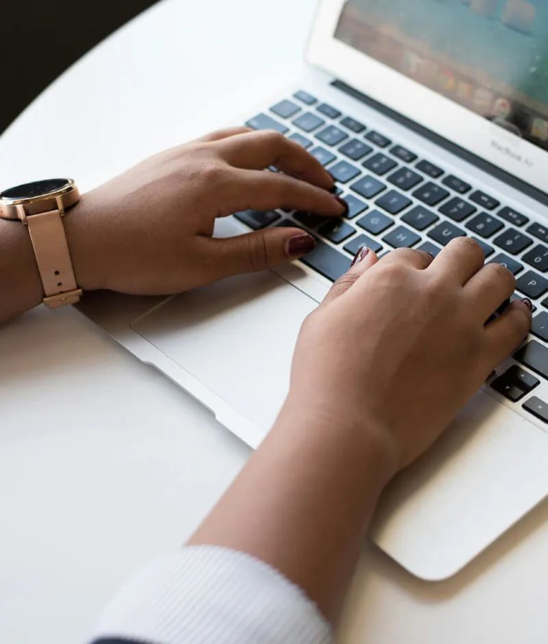 Woman typing on laptop