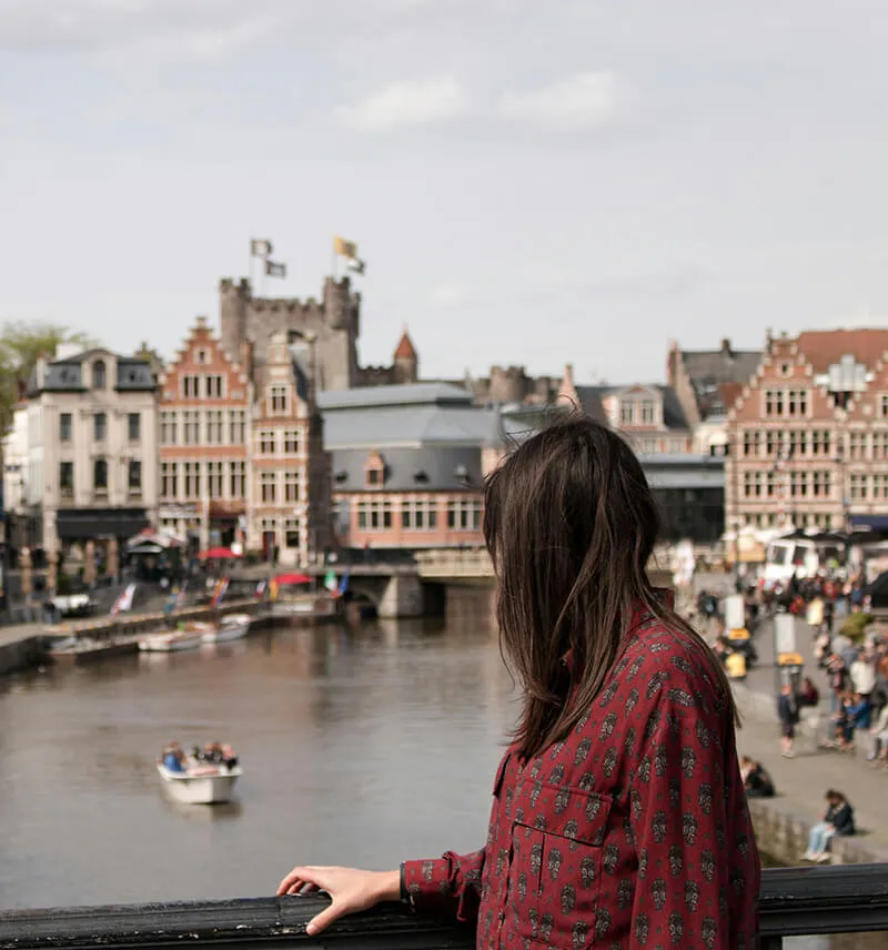 Woman standing on bridge in Belgium