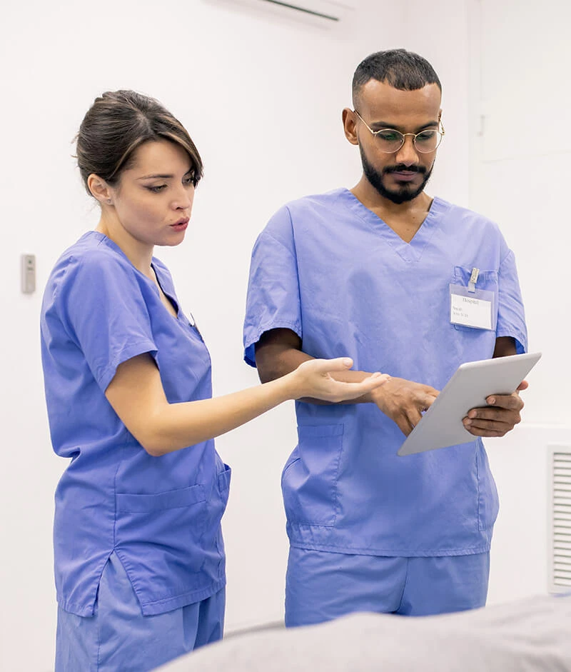 Nurses discussing patient chart