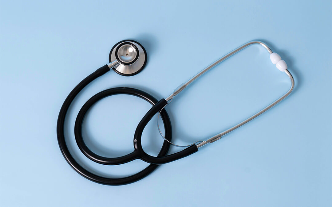 A stethoscope on a blue background